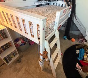Free twin loft bed w/ slide. Needs sanding and paint job