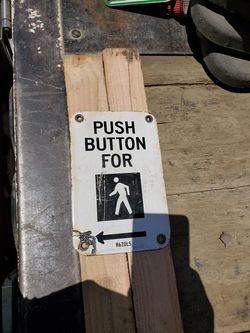 Porcelain ped push button sign