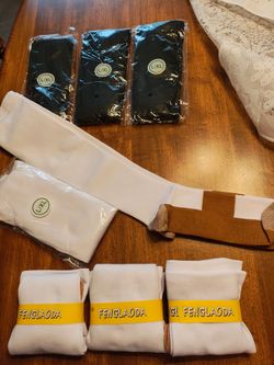 Compression socks. New. Black and white top paired are the same. Bottom are different. Price for all.