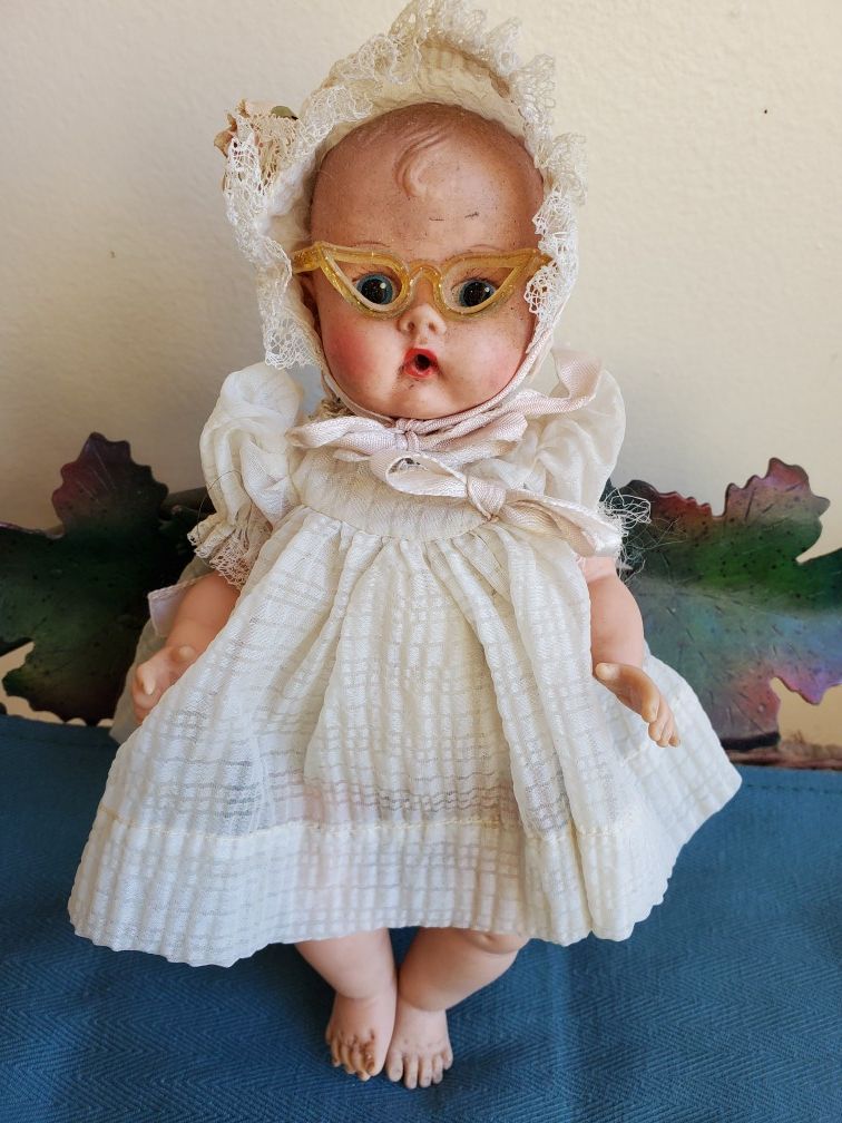 Vintage soft plastic doll with glasses