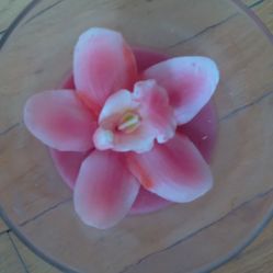 Pink flower candle in glass vase (8.5in). New