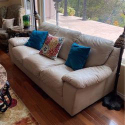 Two couches tan leather