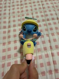 Stitch on scooter figurine