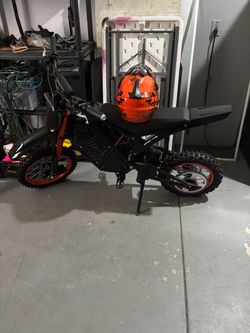 Eskute electric dirt bike with helmet and charger