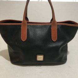 Vintage Dooney and Burke Handbag  Leather in Excellent Condition  Inside there is a stain against the side wall but it can be washed.  