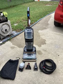 Bissell Revolution HydroSteam carpet washer with upholstery hose and attachments