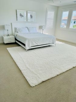 Low profile King bed frame, white gloss, side tables, lamps, carpet 8x 10 white low shag. 2 wall paintungs