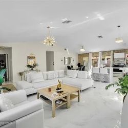 Modani Sectional Reclining Couch, Love Seat & Coffee Table