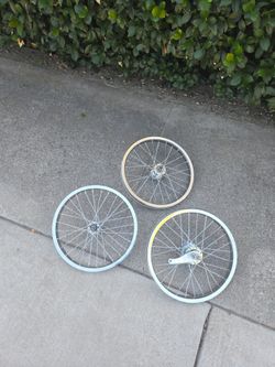 3 12" bike rims two front 1 back/ rear