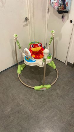 Fisher-Price Rainforest Jumperoo baby activity center.