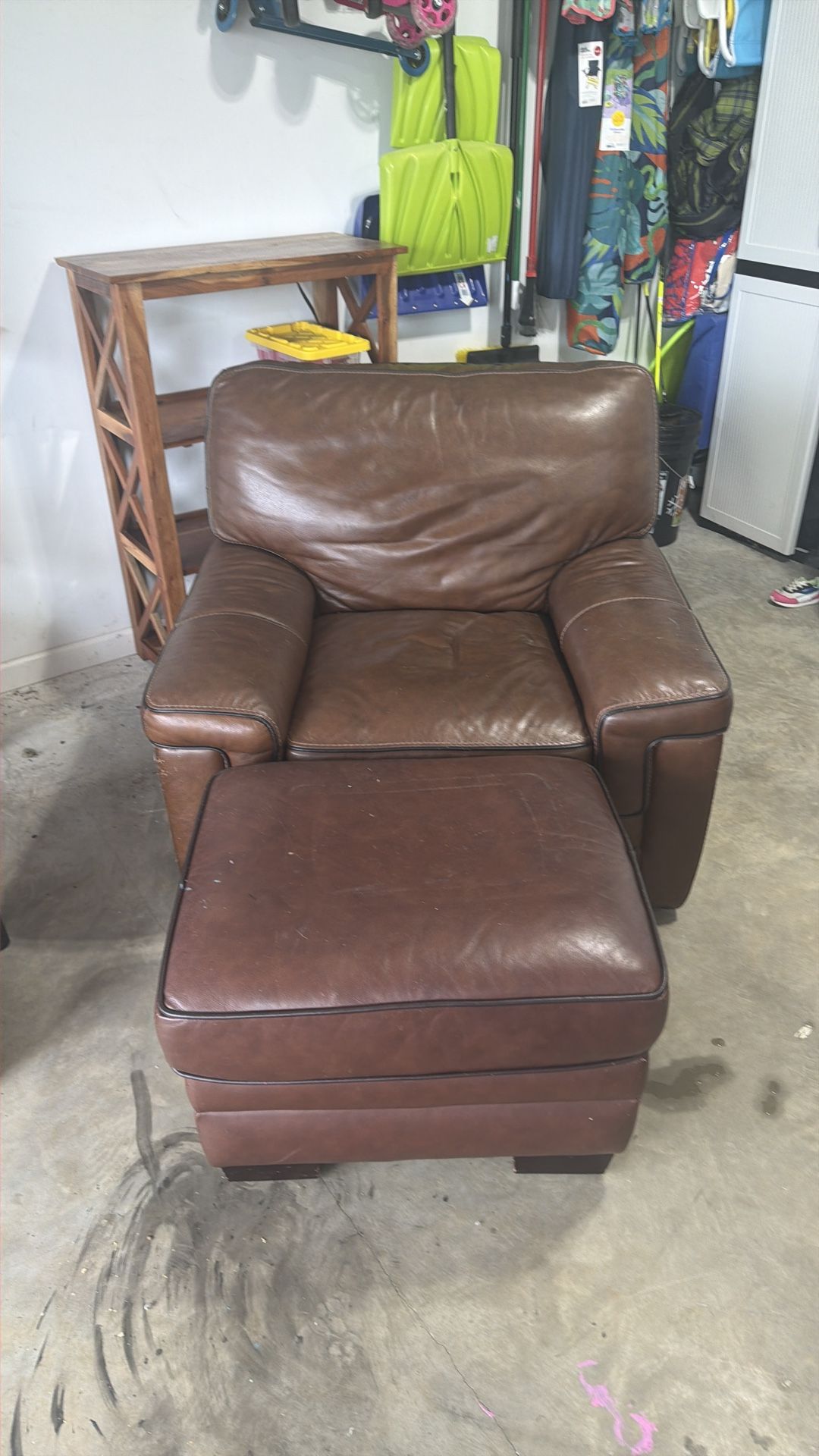 brown leather swivel chair with ottoman