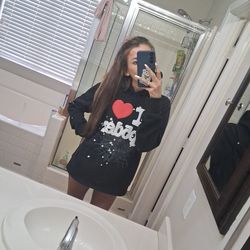 Sp5der Worldwide black hoodie × "I Heart" souvenir collection.