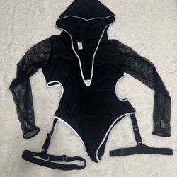 Stylish black one-piece bodysuit featuring a hood and mesh long sleeves. Has light reflective trim accents the neckline, hood, and leg openings for a 