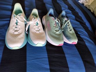 2 Hoka, one white and one green both sizes 8.5,