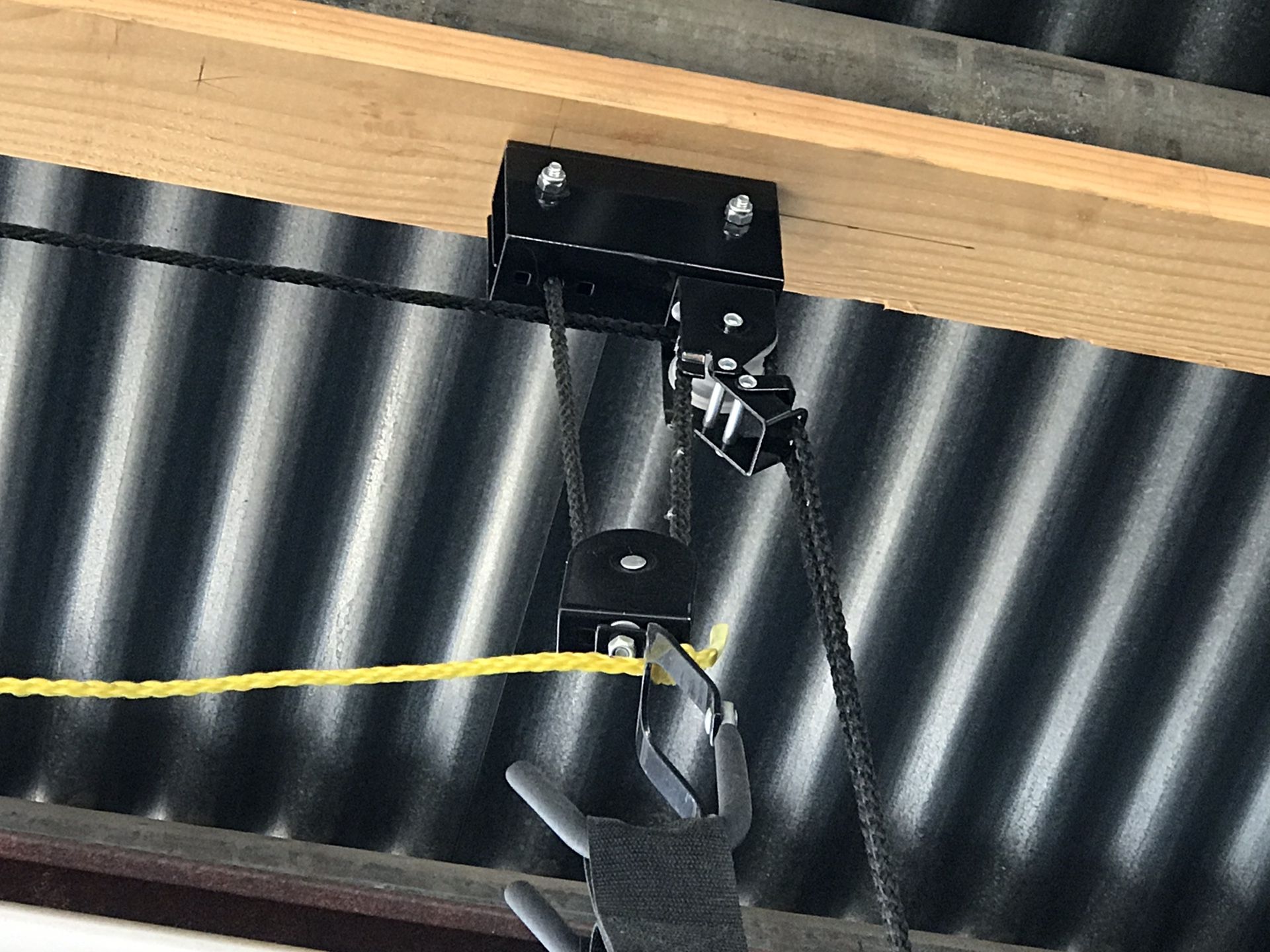 Kayak storage hoist for two kayaks or bikes.