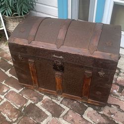 Antique humpback trunk embossed metal with wood slats
