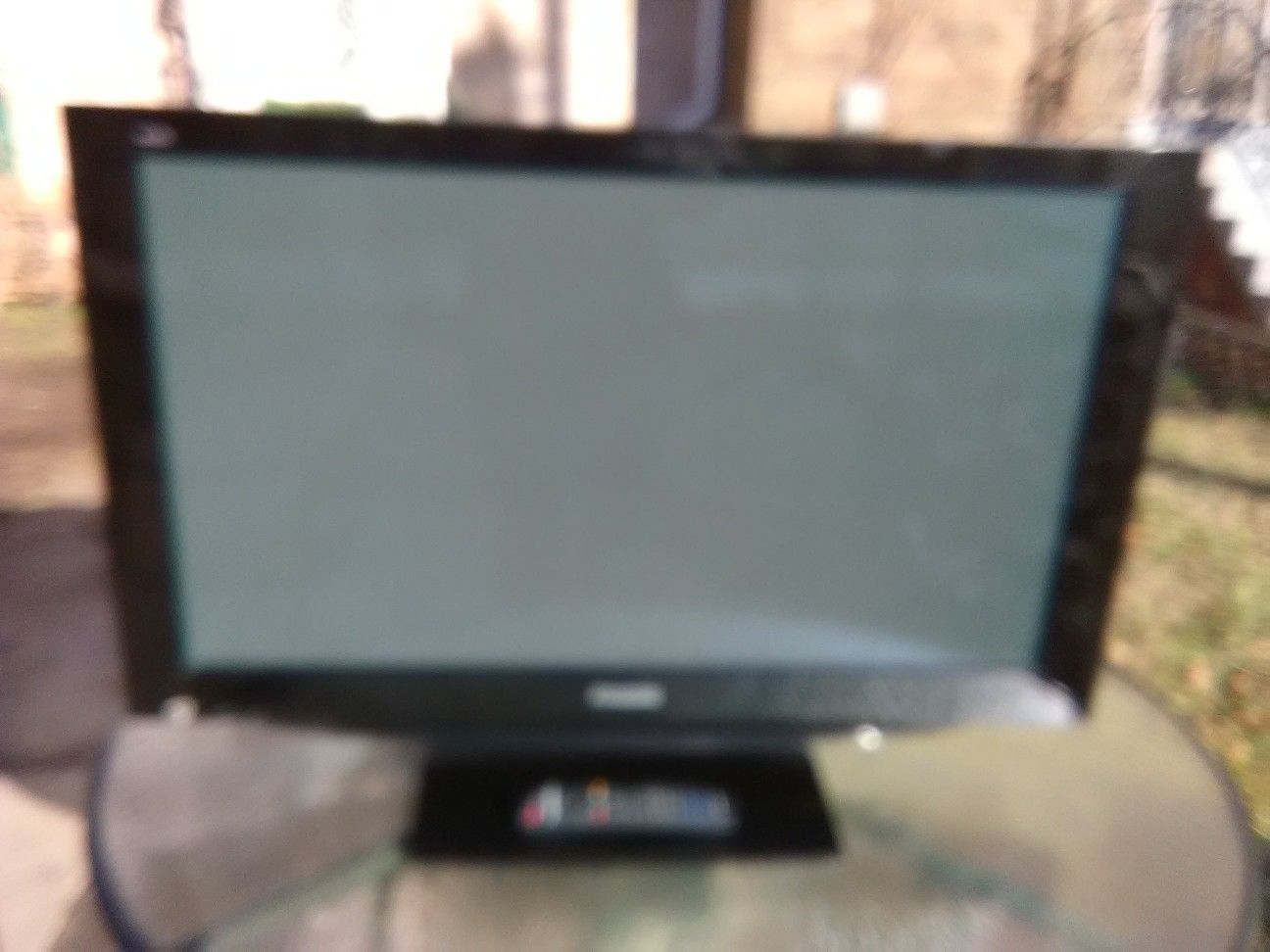 Black Panasonic 42 inch TV with remote control and HDMI port