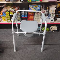 Commode with accessories doesn't look like it was ever used