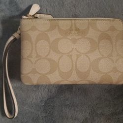 Coach Outlet Double Corner Zip Wallet / Wristlet In Signature CanvasSignature coated canvas Two credit card slots Double zip closure fabric lining Wri