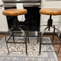 World Market Wood Adjustable Swivel Barstool Set Of Two; 2” ft for standard use at its lowest use and it goes as high as 2 ft  6 inches