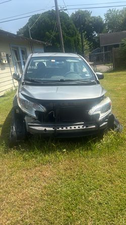 Damaged Silver Sedan – Parts or Rebuild