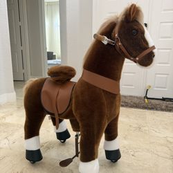 kids' ride-on plush horse toy with wheels.