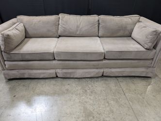 Plush Grey Three-Seater Sofa with Rolled Arms