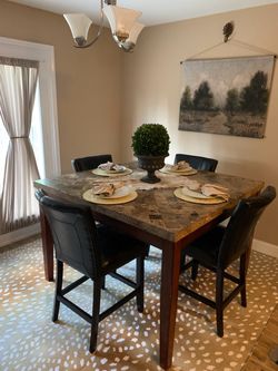 Travertine table, 4 leather bar chairs