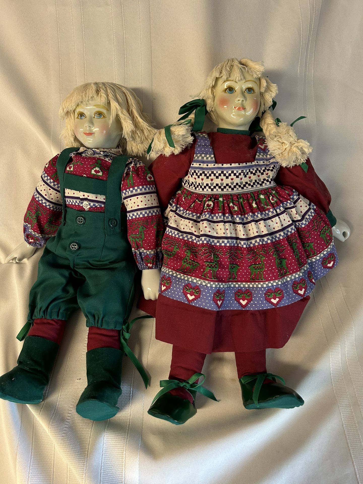Two Orma Porcelain Christmas Dolls