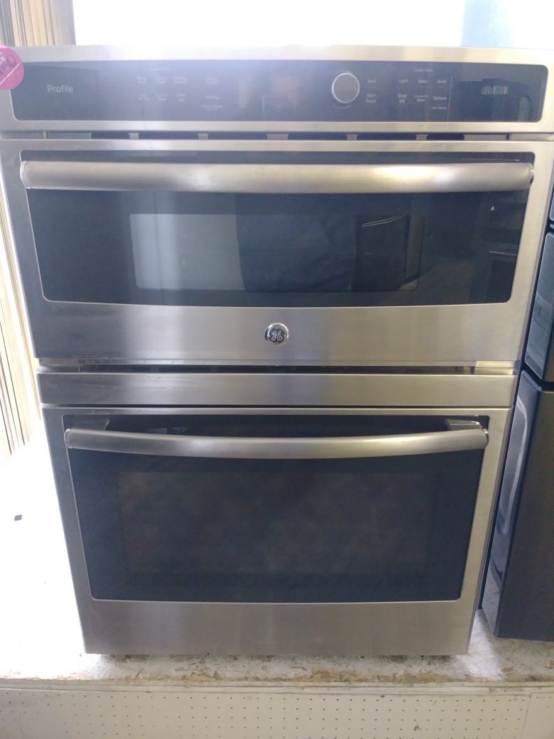 Brand new GE stainless steel wall mount oven with microwave