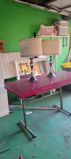 Pink desk and two lamps