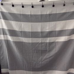 Selling my shower curtain comes with a gray liner, brand new and hooks, white and gray