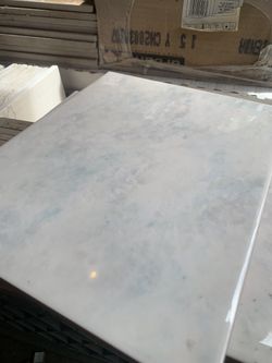 9 7/8” X 7 7/8” Tiles.
