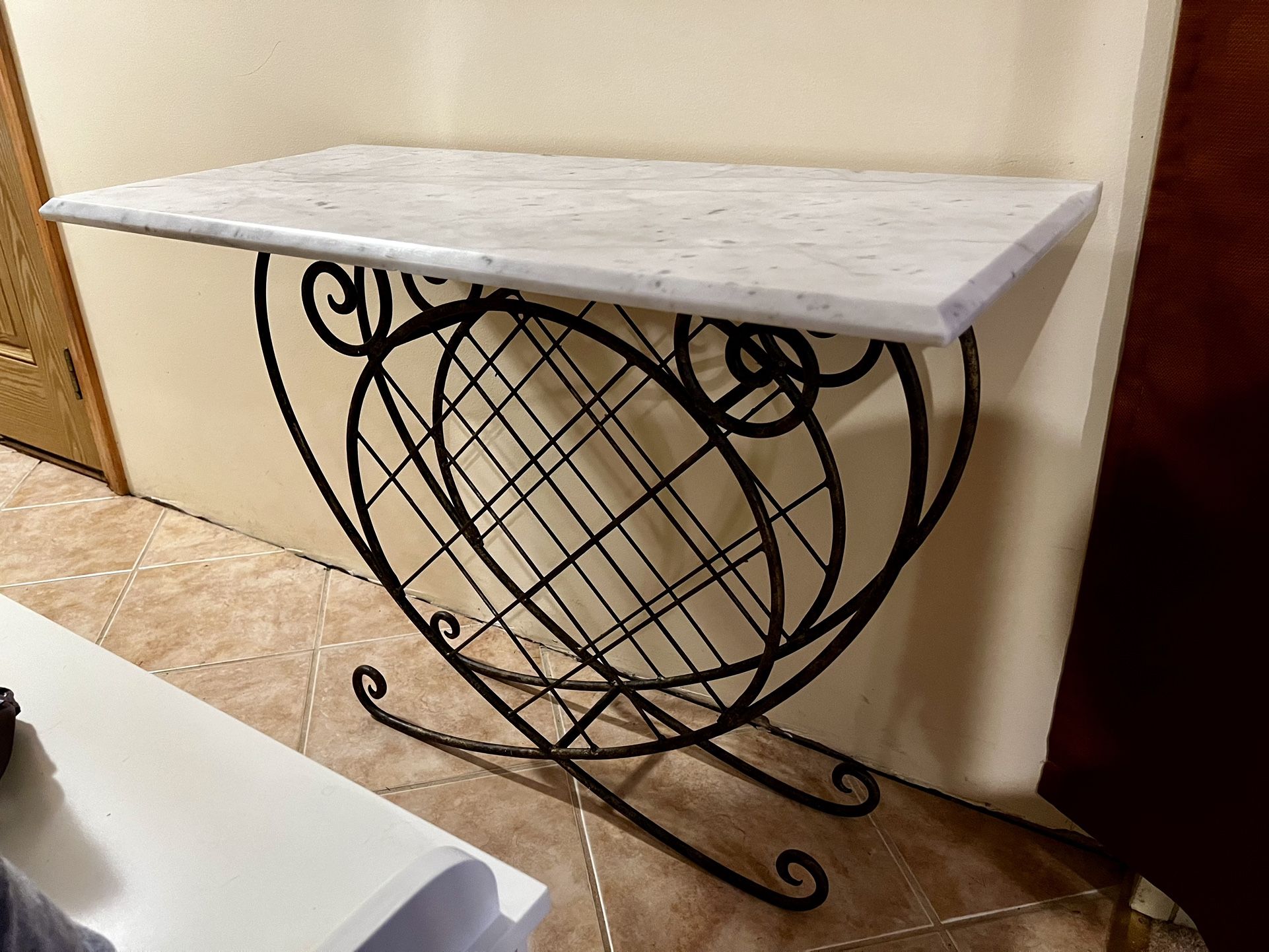Vintage wrought iron wine rack with marble top