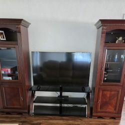 Two-piece Entertainment Center / Armoire Cabinet. Dark wood.