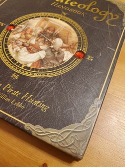 The pirateology handbook and one handmade pirate treasure ring by captain william lubber