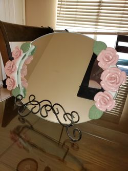 beautiful mirror with glass flower decoration with its base