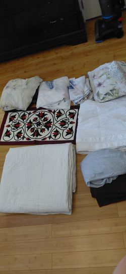 2 bags of household stuff . Blankets.  Pillowcase.  Cover bed .. window curtains etc