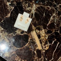 A Gold Double Ring And Money Sign Earrings Shoot An Offer 