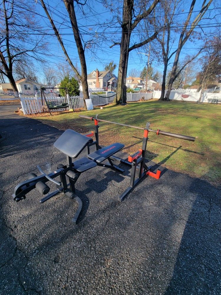 Bench Set - 45lb Olympic Barbell, Rack w spotters, & Bench w preacher pad & leg developer