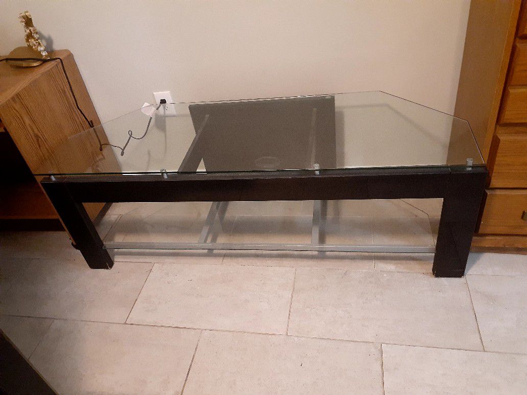 TV stand holds up to a 55 inch flat screen TV delivery available for fee