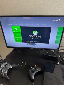 XBOX 360E CONSOLE BADAVITAR WITH EXTERNAL HARD DRIVE WITH GAMES SAVED. IF AD IS UP I STILL HAVE