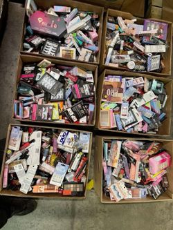Assorted boxes of skin care makeup and nail supplies