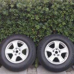 Four 17" wheels and 4 tires 245/75 R17  (20% thread)