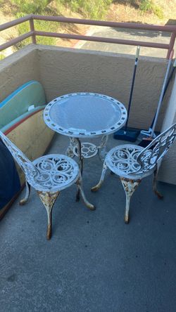 Metal and glass patio set