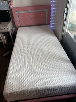 Pink twin bed + mattress Included
