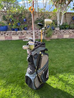 Titleist Golf Bag & Assorted Golf Clubs & Retriever