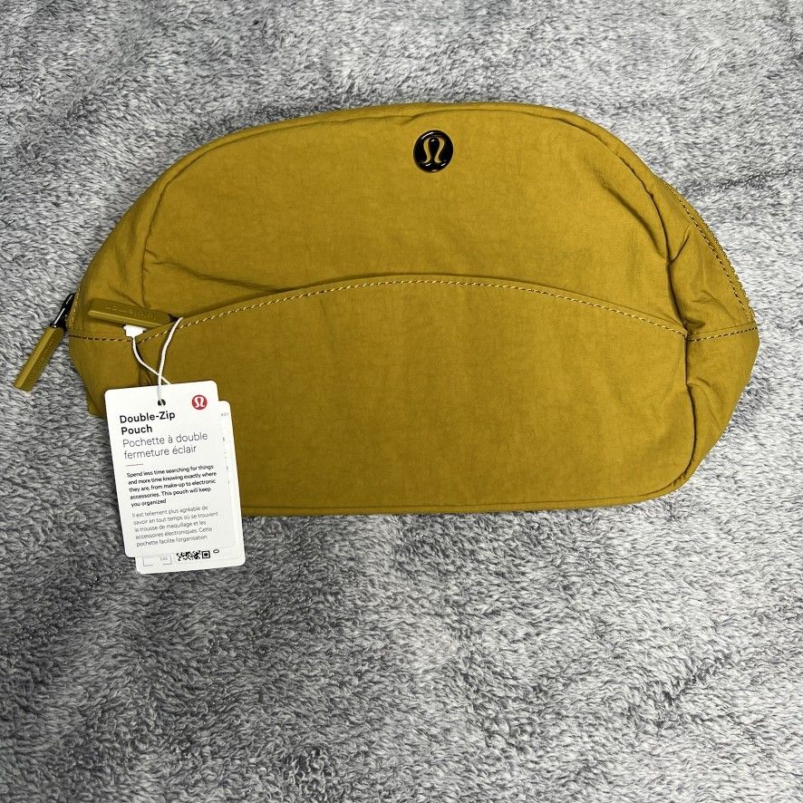 lululemon bag with gold zipper Everywhere Wordmark Crossbody Belt 1L while the water Everywhere Belt Bag 1L *Metal