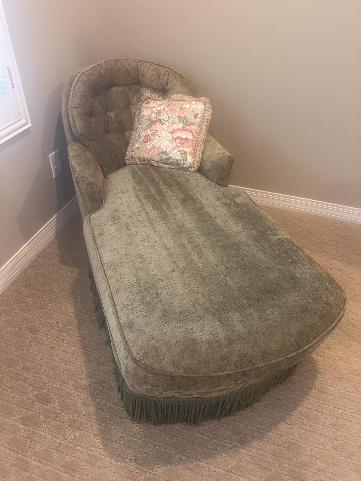 upholstered chaise longue with a fringe skirt