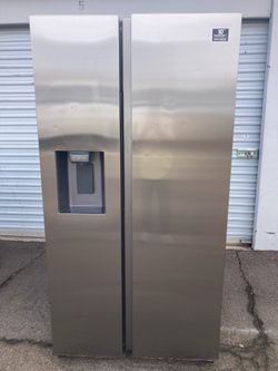 Samsung side-by-side stainless steel refrigerator in good, clean, and attractive condition. One month warranty. Delivery available. Dimensions: W36-D3